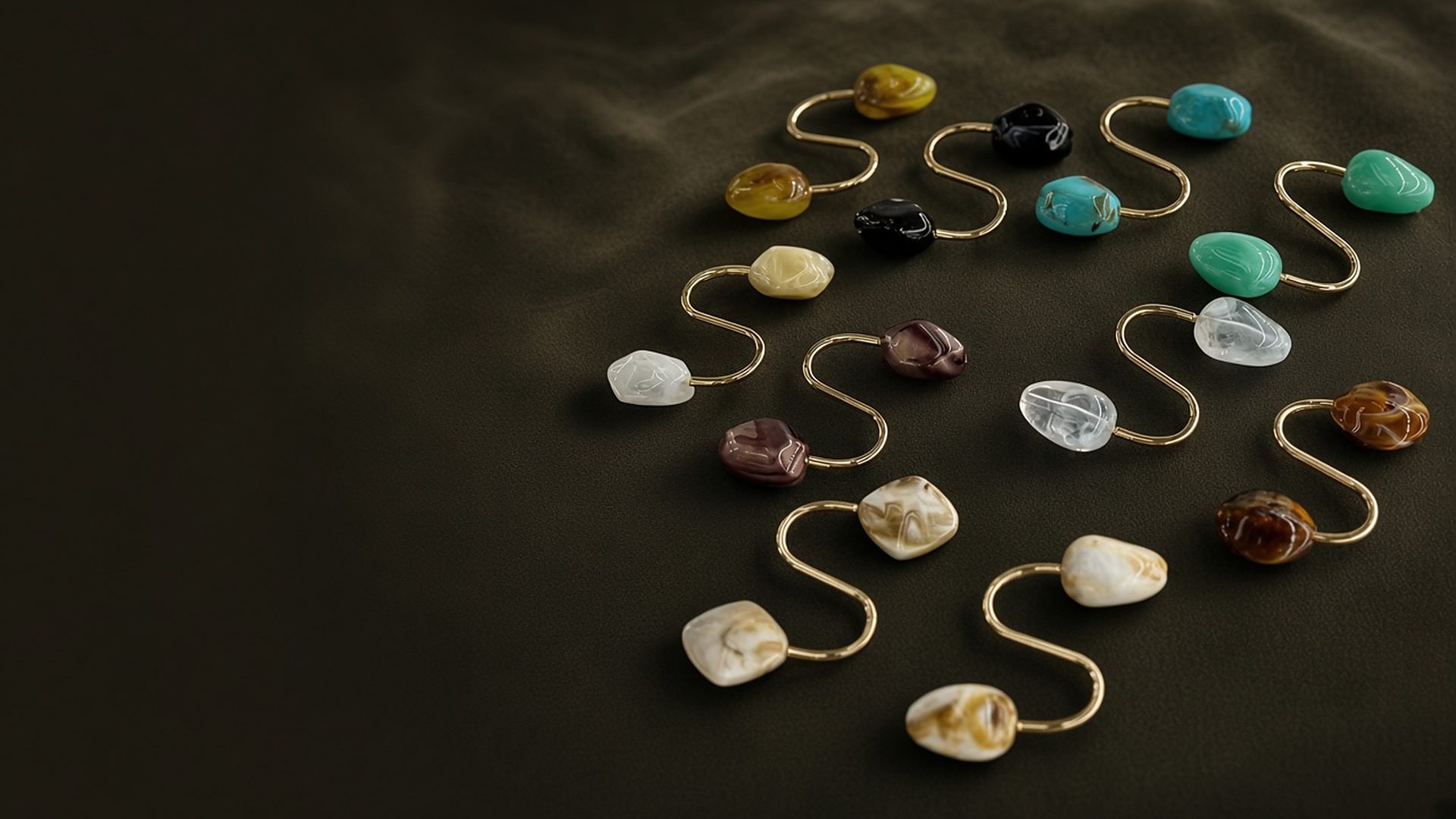 Natural stone S-hook scarf pins with gold wire on dark olive velvet
